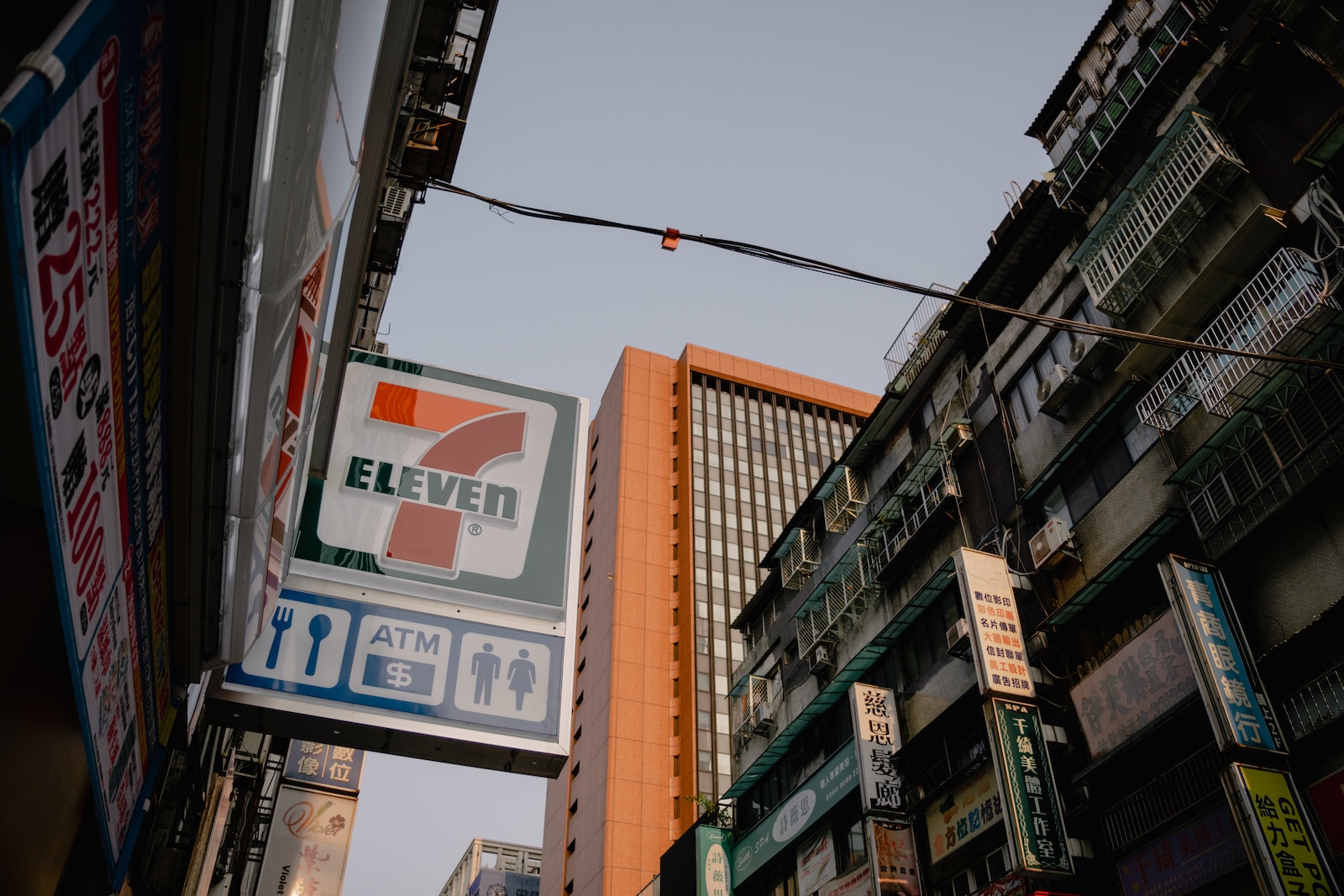 a street sign hanging off the side of a building