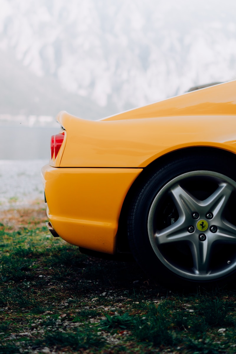 a yellow car parked on grass
