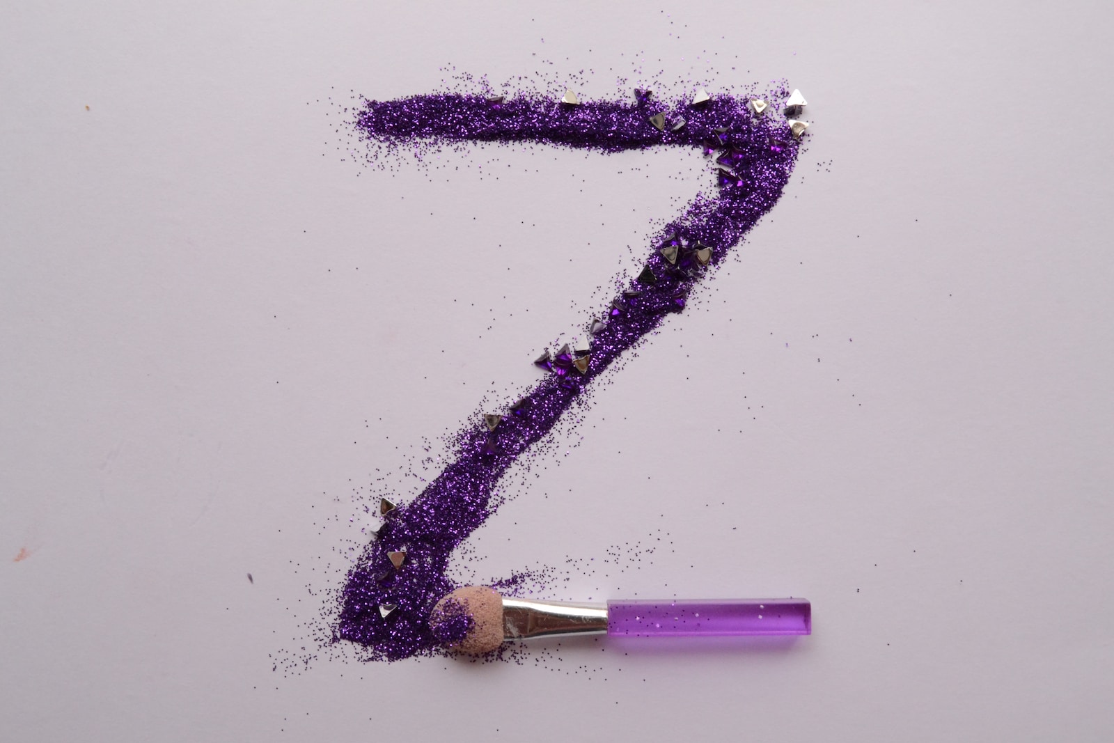 purple and white stick with white background
