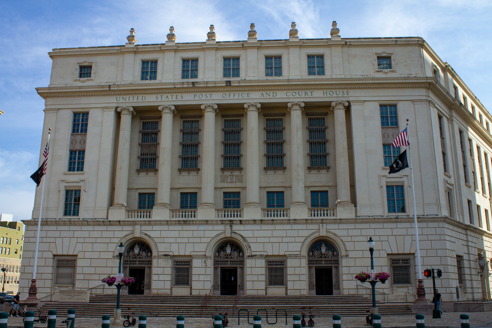 a large white building with a flag on top of it