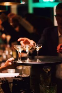 woman holding martini glass